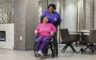 Skilled nursing assisting elderly lady in a wheelchair